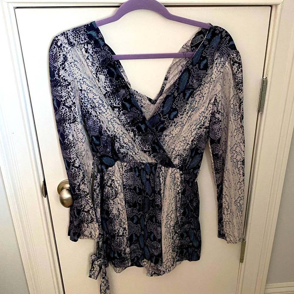 Ladies v-neck shorts romper with long sleeves.